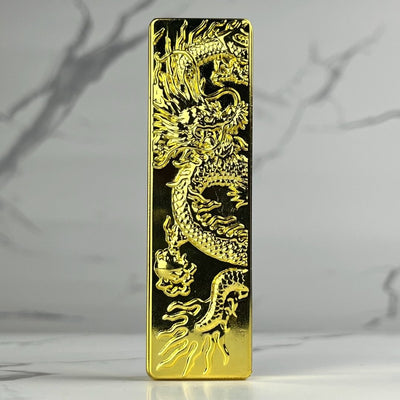 Engraved Dragon Lighter – polished gold refillable butane metal lighter featuring a 3D dragon engraving that radiates luxury and power
