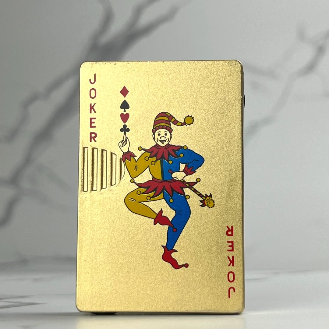 Gold Joker Torch Lighter – refillable butane poker card lighter with metallic gold Joker face design and torch flame ignition