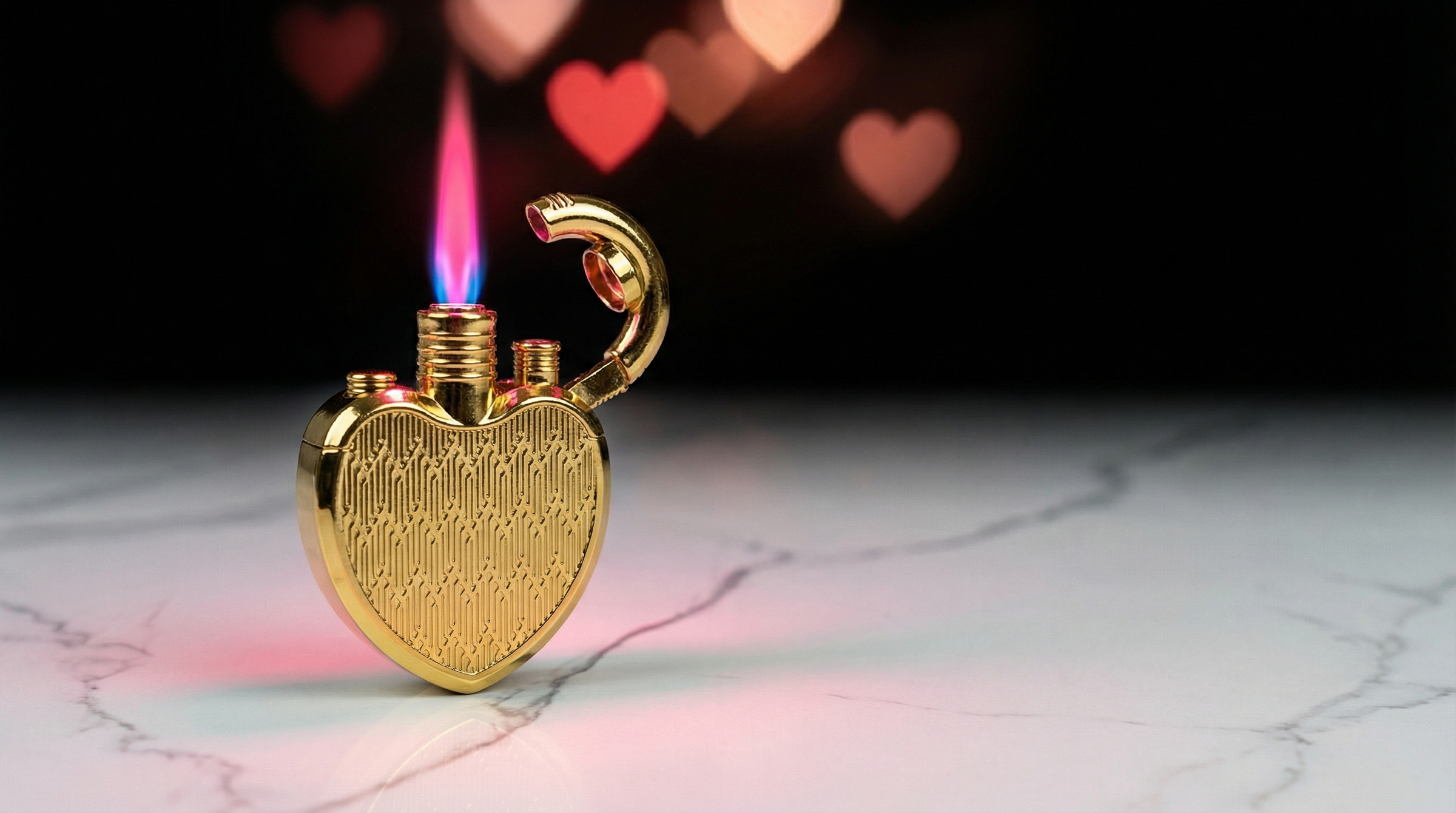 Gold heart-shaped torch lighter lit with pink and blue flame on white marble counter against black Valentine’s background with subtle heart lights.